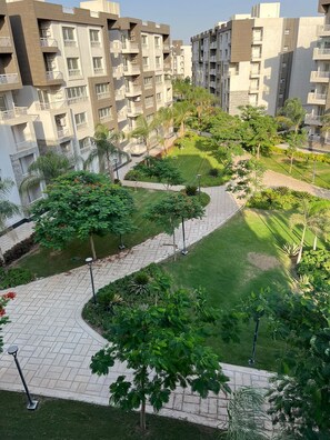 Superior Apartment, Multiple Beds, Air conditioning, Garden View | Property grounds - Cozy Retreat in Madinty & Work-Station (New Cairo)