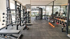A gym with weightlifting equipment, treadmills, and dumbbells. - A luxury space designed to make you feel at home (Asunción)