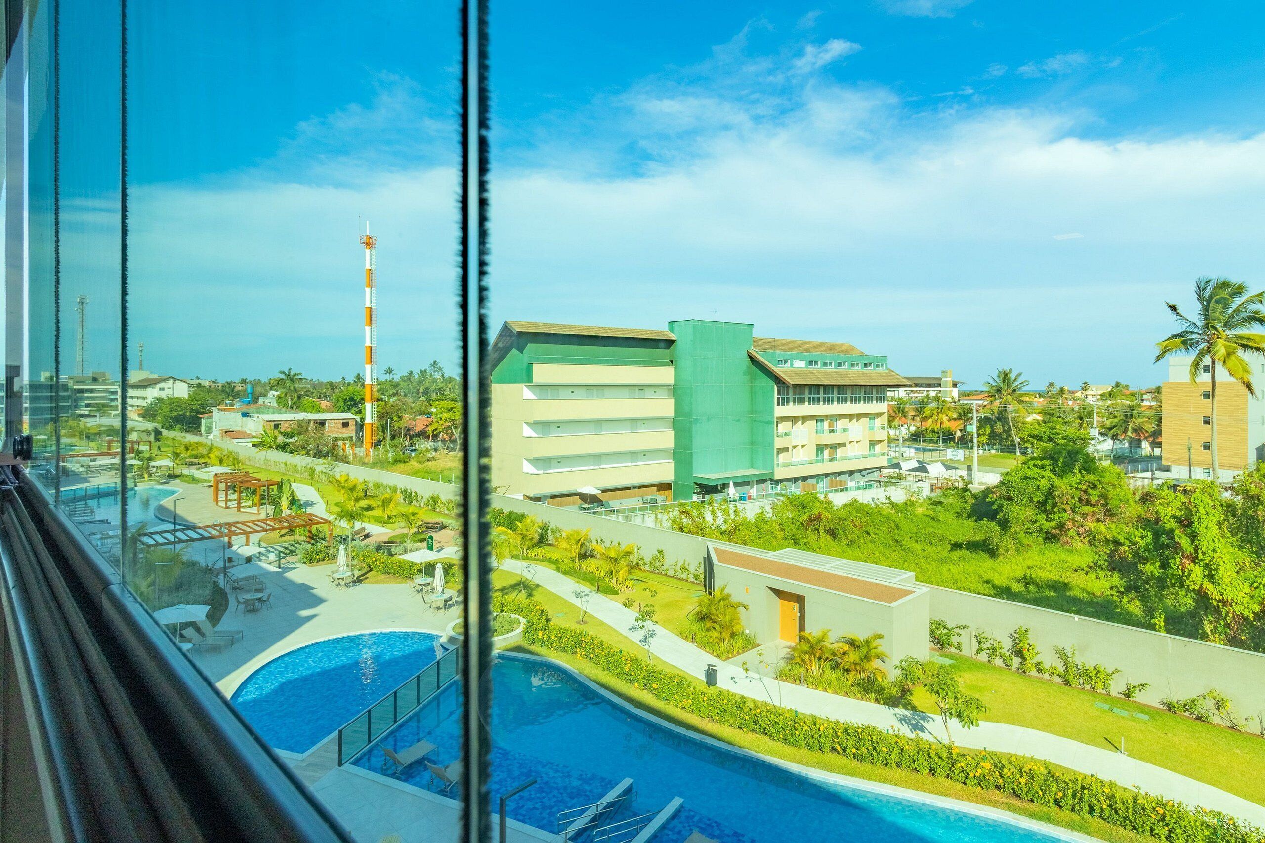 Departamento Confort | Alberca | 2 albercas techadas, sombrillas en la alberca y camastros 