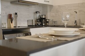 Exclusive Apartment | Private kitchen | Full-size fridge, microwave, stovetop, cookware/dishes/utensils - 1BRM Infinity Homes Punta Cana (Punta Cana)