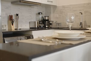 Exclusive Apartment | Private kitchen | Full-size fridge, microwave, stovetop, cookware/dishes/utensils