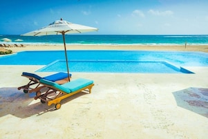 Private beach, white sand, beach cabanas, sun loungers