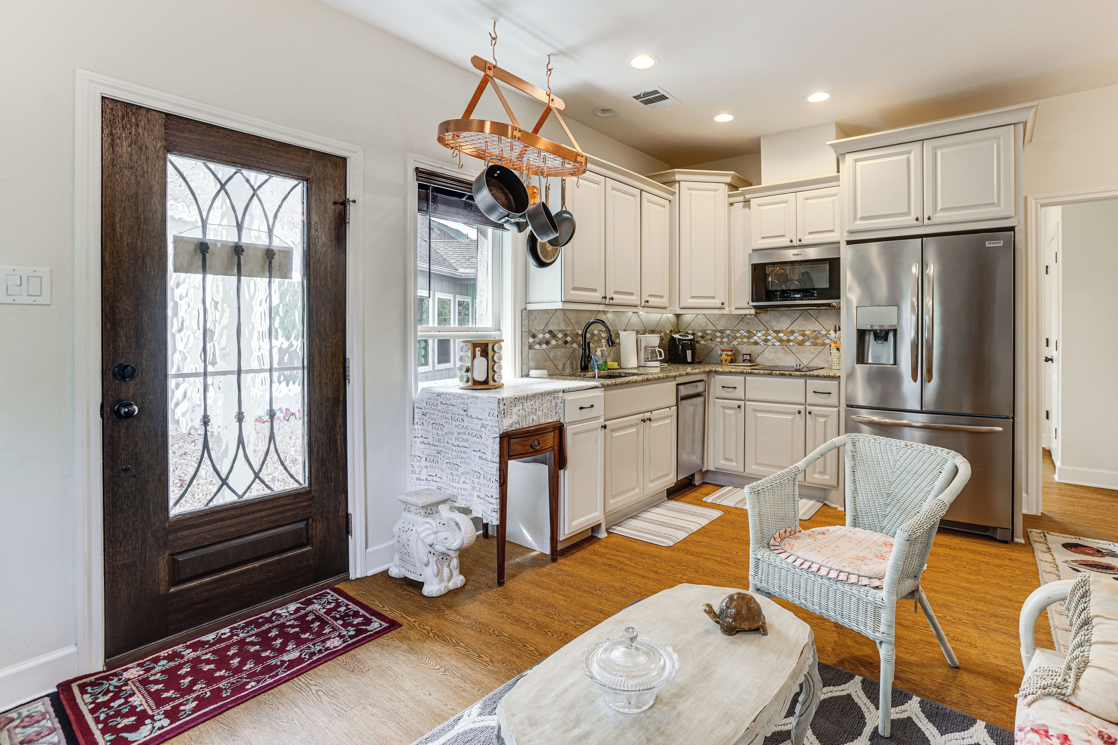 Fridge, microwave, cookware/dishes/utensils, dining tables