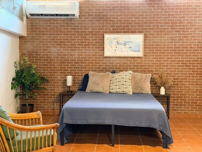 Studio with AC in vibrant Ponce near beach, downtown, airport and highway.