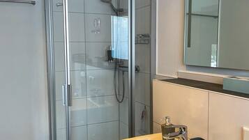 Shower, hair dryer, towels, soap