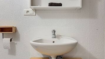 Shower, towels, soap, toilet paper