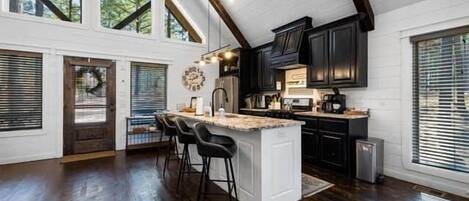 Coffee/tea maker, fridge, microwave, oven