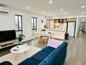 Living area - Elegant 3-Bedroom House with Free secured Parking (Clyde North)