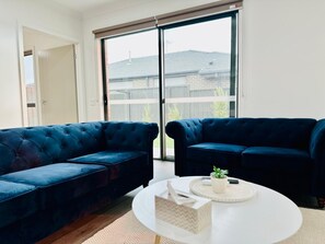 Living area - Elegant 3-Bedroom House with Free secured Parking (Clyde North)