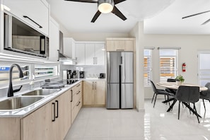 Fridge, microwave, stovetop, coffee/tea maker