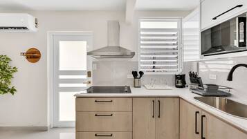 Fridge, microwave, stovetop, coffee/tea maker