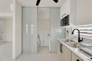 Fridge, microwave, stovetop, coffee/tea maker - Cozy Retreat with Private Balcony, 2 BR | Sleeps 6 (2B HR) (San Juan)