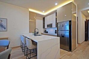 Fridge, microwave, stovetop, dishwasher - Modern 2BR Apartment Near the Malecón | Balcony • Rooftop BBQ (La Paz)