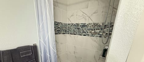 Shower, towels, soap, toilet paper