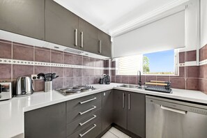 Fridge, microwave, oven, stovetop - Leafy Lane Cove Family Apartment | AC + Parking (Lane Cove North)