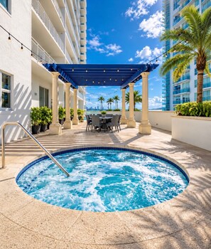 Shared hot tub and seating area, subject to building hours and maintenance.