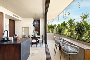 Outdoor dining - Beachfront 2BR Condo in Bahía Tankah, Tulum (Tulum Municipality)