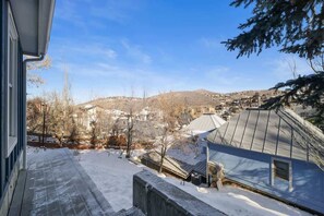 A residential area with snow-covered roofs and a clear view of houses and hills in the distance. - Old Town Park City House Walk to Main Street (Park City)