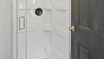 Shower, towels, soap, toilet paper