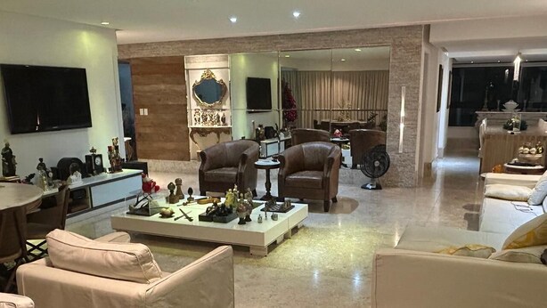 A spacious living room with leather sofas, a coffee table, and a television. - Luxury Apartment in Ondina (Carnival - Barra-Ondina Circuit) (Salvador)