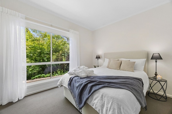 Bedroom with queen bed and high-quality linen