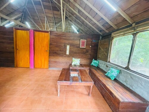 Rustic cabin next to a stream in nature