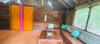 Rustic cabin next to a stream in nature