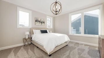 Desk, laptop workspace, blackout drapes, iron/ironing board