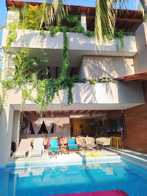Outdoor pool, open 9:00 AM to 10:00 PM, pool loungers