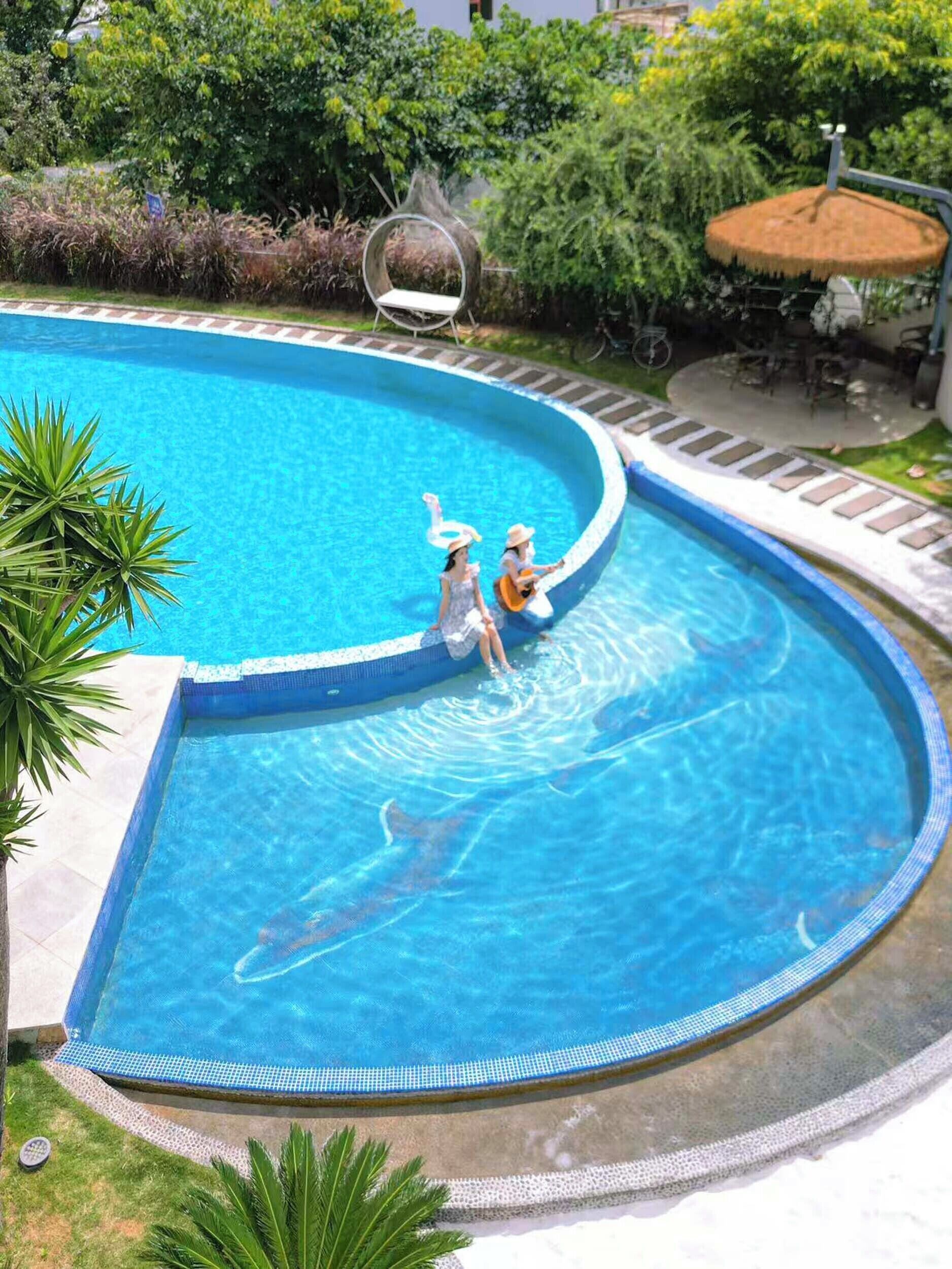 Outdoor pool, open 8:00 AM to 10:00 AM, pool umbrellas