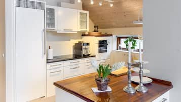 Fridge, dishwasher, coffee/tea maker, cookware/dishes/utensils