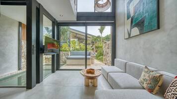 Standard Villa, Balcony, Pool View | Living area | TV