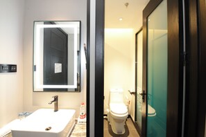 Shower, hair dryer, slippers, towels