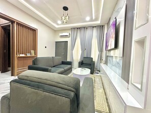 Living area - 2-bedroom Apartment in serene Opic Estate with AC comfort (Opic)