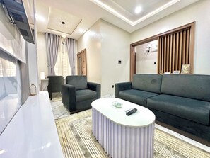Living area - 2-bedroom Apartment in serene Opic Estate with AC comfort (Opic)