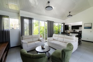 Living area - Spacious 3-bedroom condo in beautiful Punta Leona beach  with AC (Playa Herradura)