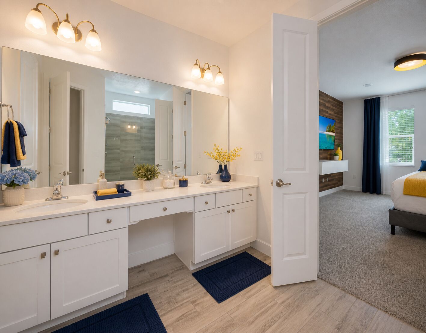 A modern bathroom with a large mirror, dual sinks, and a vanity with storage.