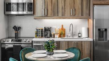 Coffee/tea maker, fridge, microwave, oven