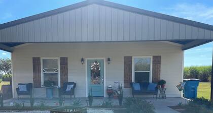 Sugar Cane Cottage is cozy with a country feeling and a big porch.