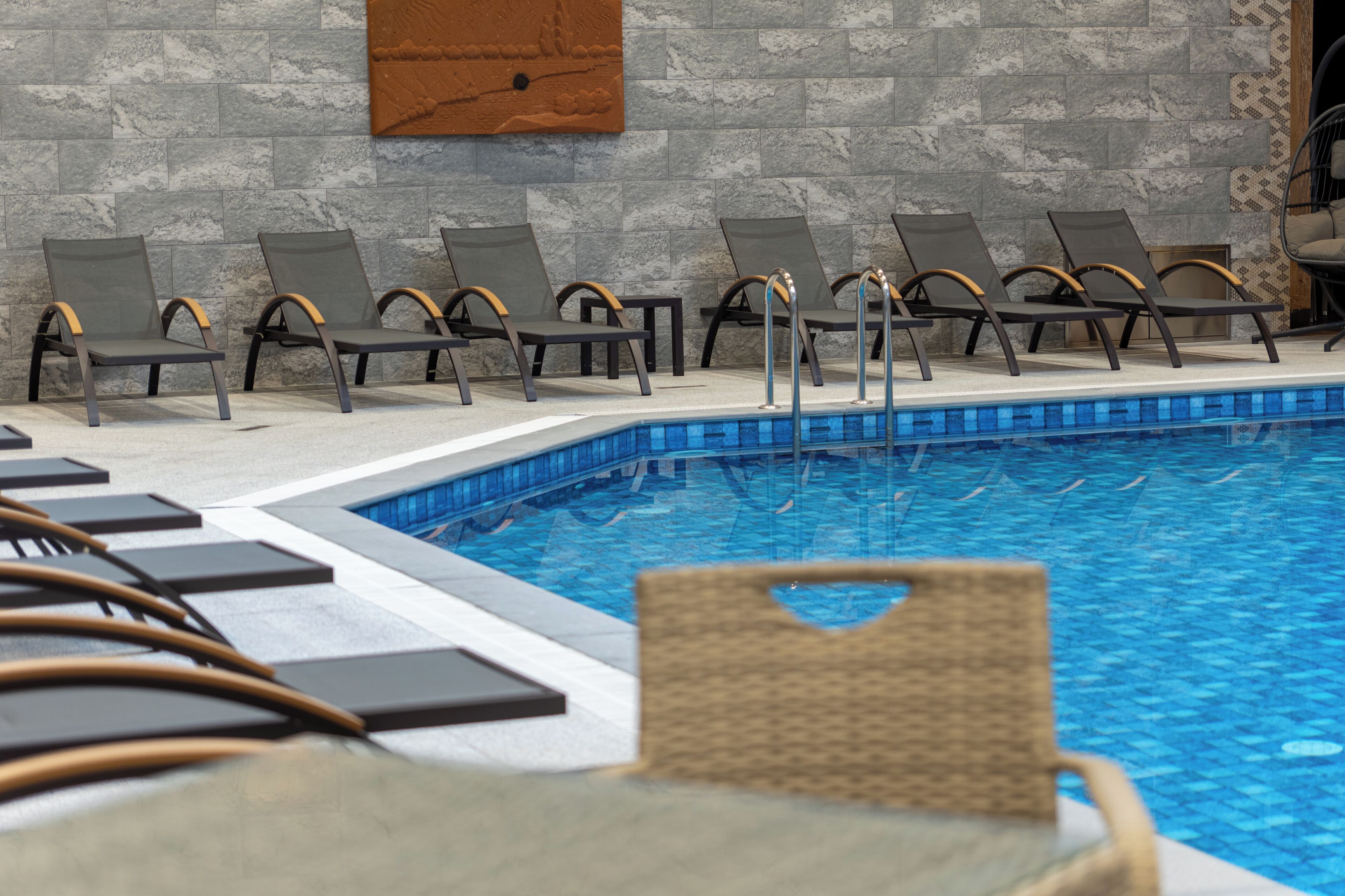 Indoor pool, open 10:00 AM to 10:00 PM, pool loungers
