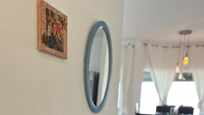 A wooden console table with decorative items, a mirror, and a painting on the wall. - Golan View Villa – Ma’ale Gamla
Villa Overlooking the Golan
Scenic Golan View (Ma'ale Gamla)