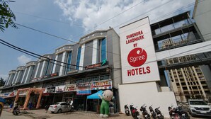 A hotel named Surendra Landmark by Spree Hotels with multiple floors and a prominent sign. - Surendra Landmark By Spree Hotels (Bhopal)