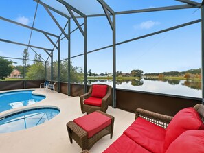 Outdoor pool, a heated pool - Family-Friendly 5-Bedroom Pool & Waterfront Sanctuary in Kissimmee. (Kissimmee)