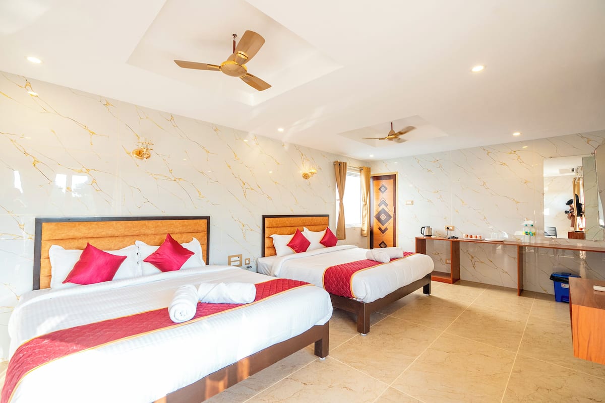 Exclusive Quadruple Room, Garden View | Desk, laptop workspace, free WiFi