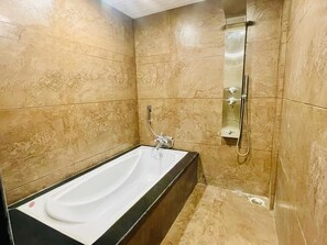 Family Suite, City View | Bathroom | Slippers, towels - Hotel Cosmos (Bhubanswar)