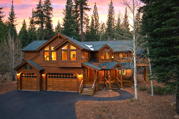 Dusk settles over this Tahoe retreat, where warm lights welcome you home after a day in the mountains.