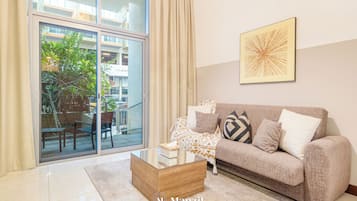 Luxe studio | Woonruimte | Flatscreentelevisie