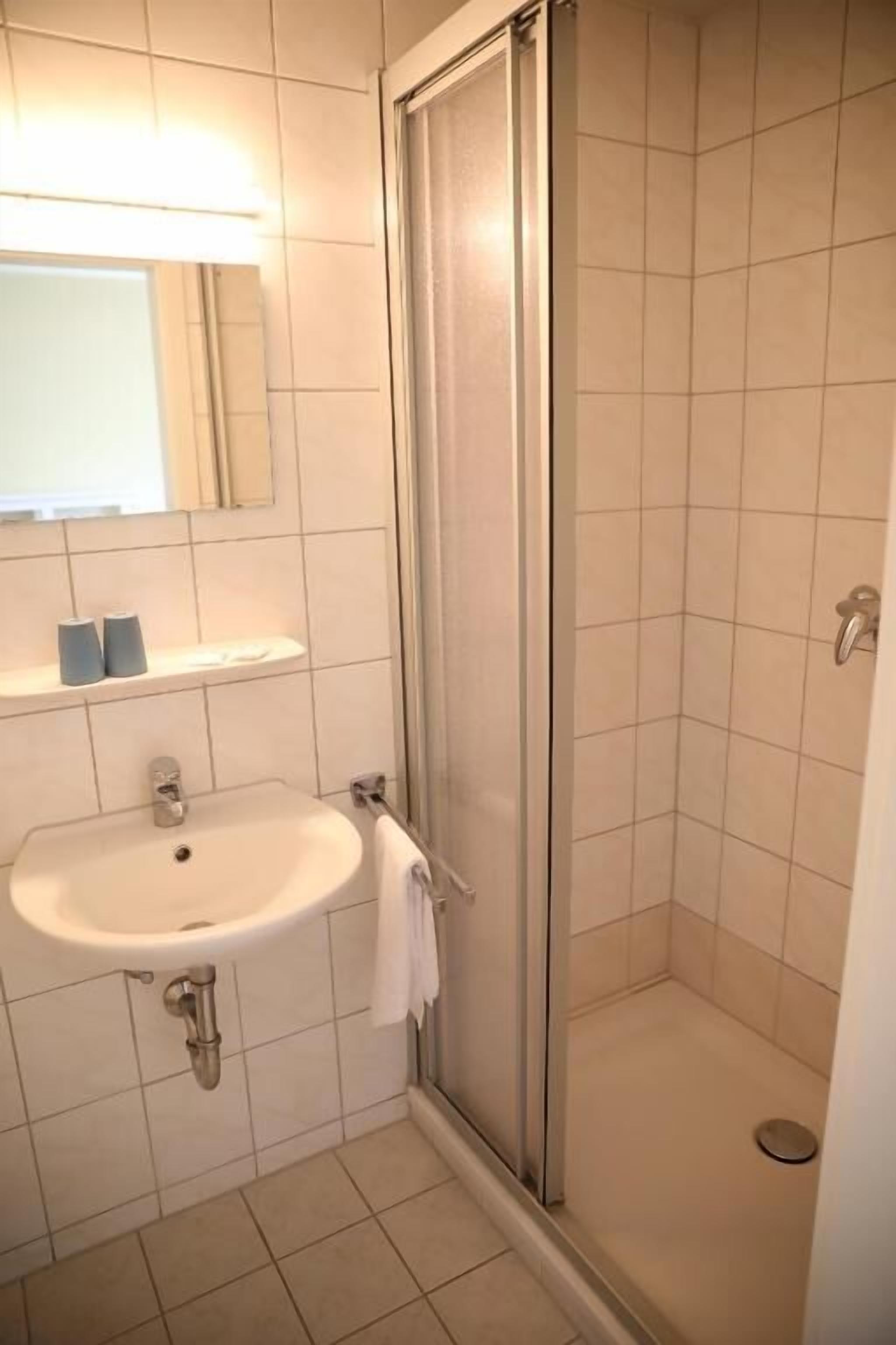 Double Room | Bathroom | Shower, hair dryer, towels, soap