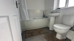 Shower, towels, soap, toilet paper