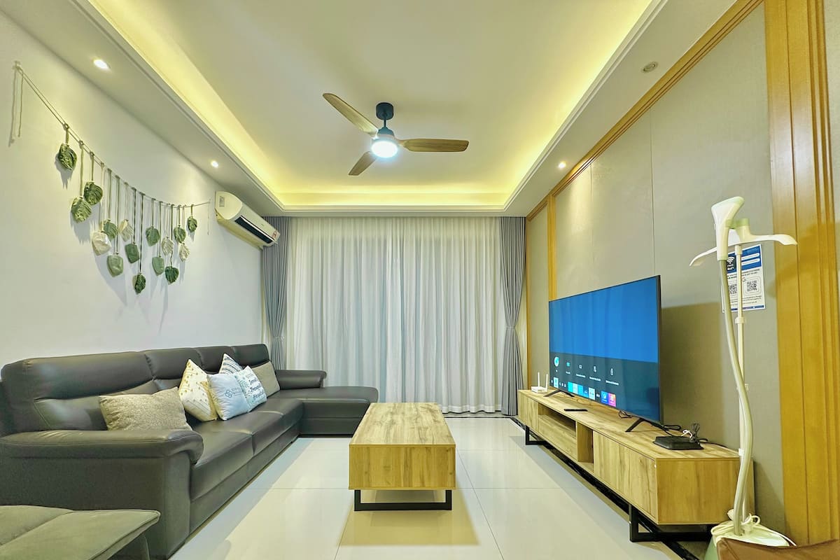 Family Apartment, 3 Bedrooms, 2 Bathrooms | Living area | 55-inch flat-screen TV with cable channels, TV